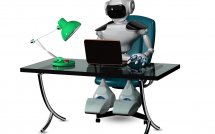 Робот сидит за компьютером