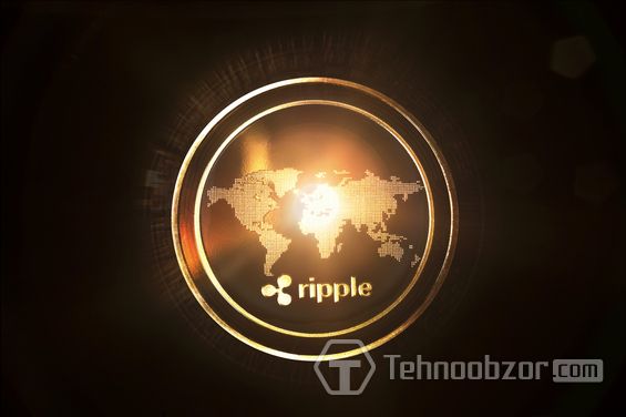 Монета Ripple с изображением карты мира