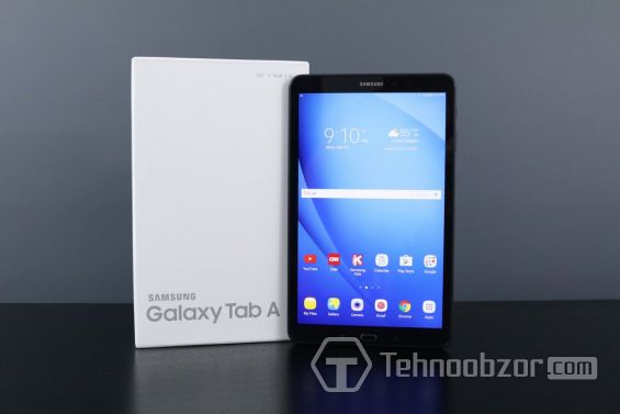 Чёрный планшет Samsung Galaxy Tab A 10.1 стоит рядом с упаковкой