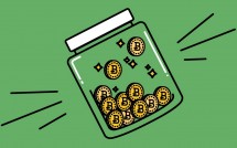 Монеты Биткоина в банке как символ стекинга криптовалют