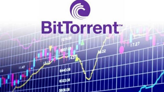 Значок криптовалюты BitTorrent на фоне графика биржи