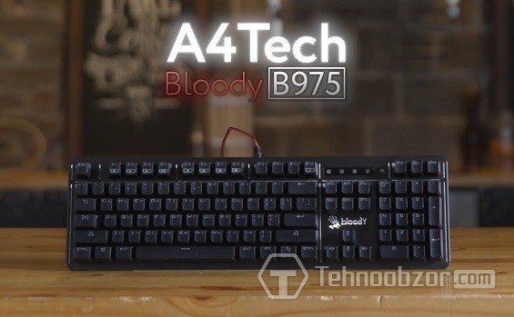 Клавиатура Bloody B975 на деревянной поверхности